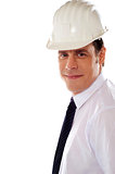 Smiling male architect wearing hard hat