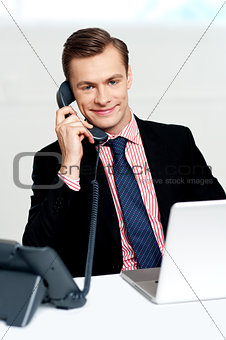 Handsome corporate man communicating