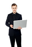Casual young man with laptop
