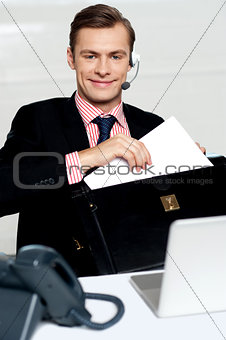 Customer care person arranging office documents