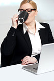 Corporate lady drinking coffee