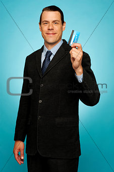 Male executive showing credit card