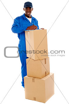 Cheerful delivery guy preparing receiving notice