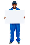 Courier guy presenting blank white billboard
