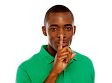 Young african guy showing silence gesture