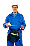Male worker stretching measuring tape