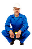 Smiling male worker wearing safety hat