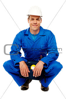 Smiling male worker wearing safety hat