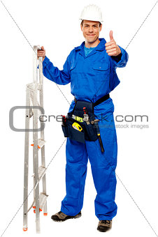 Repairman holding ladder and showing thumbs up