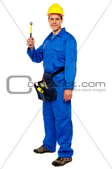 Young construction worker holding hammer