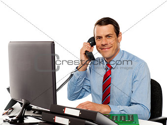 Businessman talking on phone, handling clients