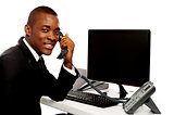 African businessman attending phone call