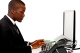 Side view male secretary typing on keyboard