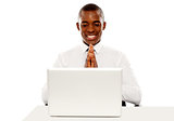 Cheerful manager looking at laptop screen