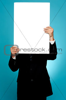 Manager hiding his face behind white banner ad