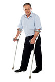 Old handicapped man with a walker