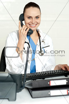 Medical expert communicating on phone