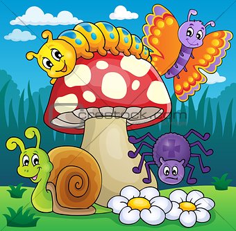 Toadstool with animals on meadow