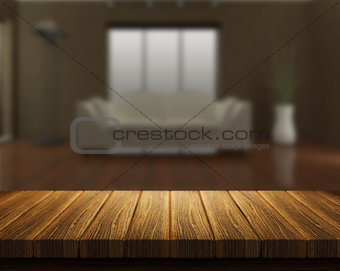 Wooden table with room interior in background