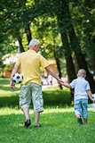 grandfather and child have fun  in park