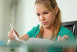 Young woman female student studying at home