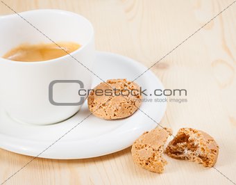 cup of italian espresso coffee near biscuit