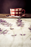 Coffee cup laid on wooden vintage table