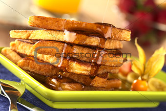 Pouring Maple Syrup on French Toast