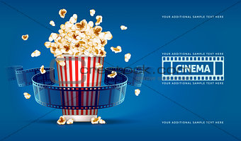 Popcorn for movie theater and cinema reel on blue background