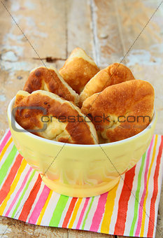 homemade fried pies with potatoes, rustic style