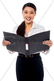 Female assistant reviewing file