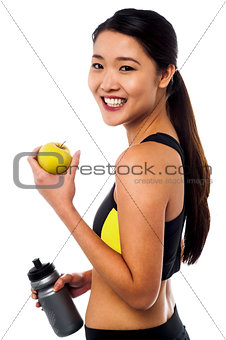 Eat healthy, stay fit. Smiling chinese girl