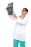 Portrait of male surgeon holding x-ray