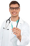 Portrait of a young doctor with medicines