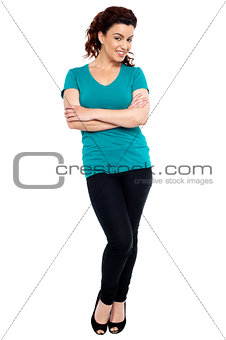 Cheerful woman posing with her hands crossed