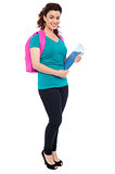 Student with backpack and spiral notebook