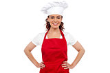 Cute female chef posing with hands on her waist