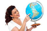 Woman holding globe in her hand