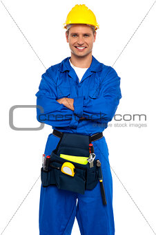 Young industrial contractor posing with crossed arms