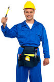 Smiling young repairman holding hammer