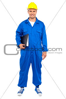 Industrial worker posing with a file folder