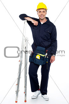 Industrial engineer resting his hands on stepladder