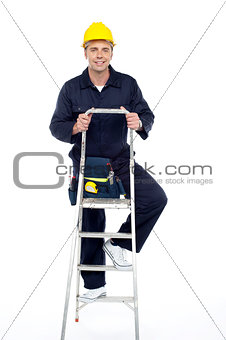 Its work time. Repairman climbing stepladder