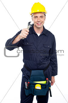 Smiling repairman holding out screwdriver