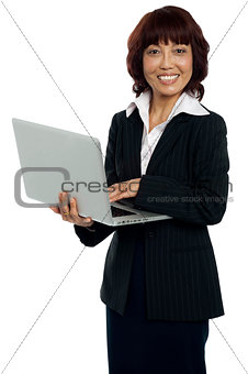 Portrait of a businesswoman working on laptop