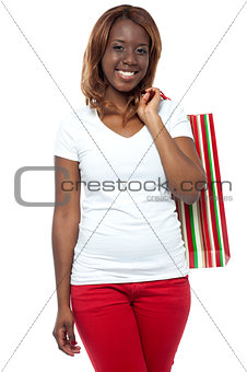 Shopper woman posing with shopping bag