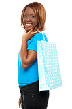 Satisfied lady shopper with shopping bag