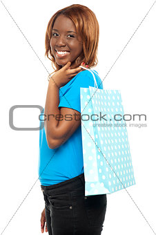 Satisfied lady shopper with shopping bag