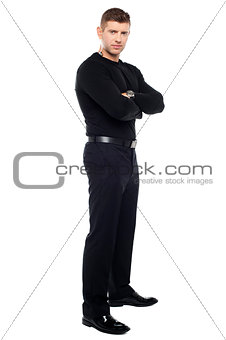 Handsome young bodyguard, full length portrait