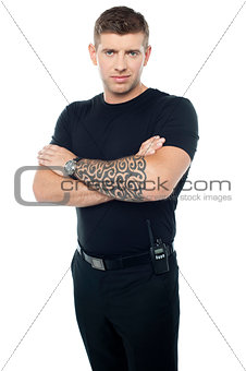 Bouncer with walkie-talkie. Tattoo on hands